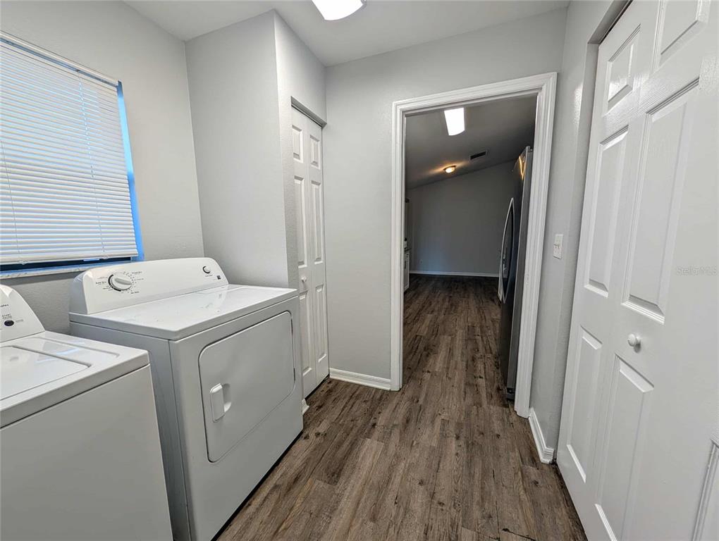 1511 Southwest Shorewood Drive Dunnellon, FL 34431 - Photo 19 of 31 a view of washer and dryer with wooden floor