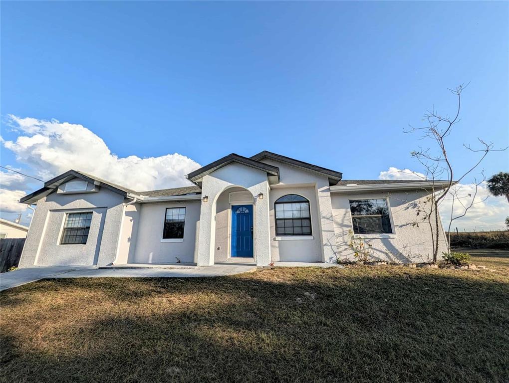 1511 Southwest Shorewood Drive Dunnellon, FL 34431 - Photo 2 of 31 a front view of a house with a garden