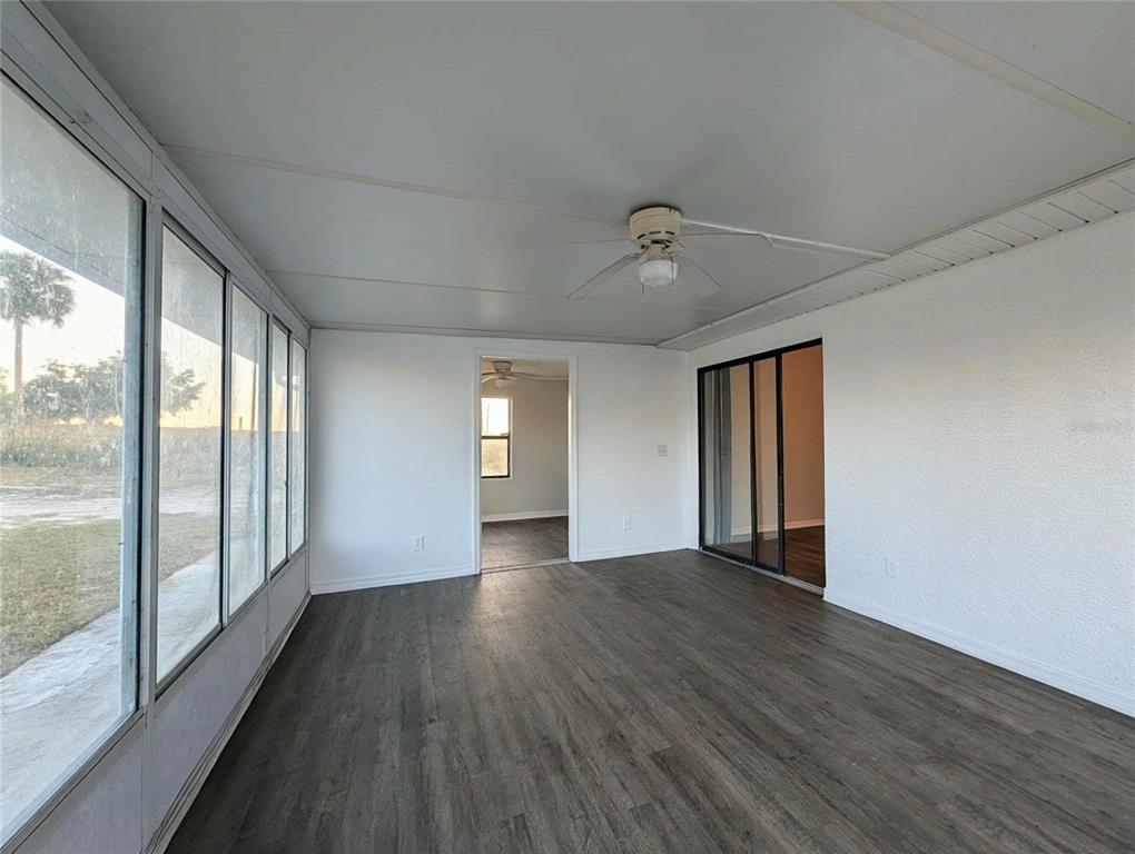 1511 Southwest Shorewood Drive Dunnellon, FL 34431 - Photo 24 of 31 a view of an empty room with wooden floor and a window