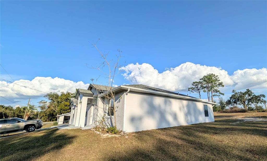 1511 Southwest Shorewood Drive Dunnellon, FL 34431 - Photo 28 of 31 a view of a house with a yard