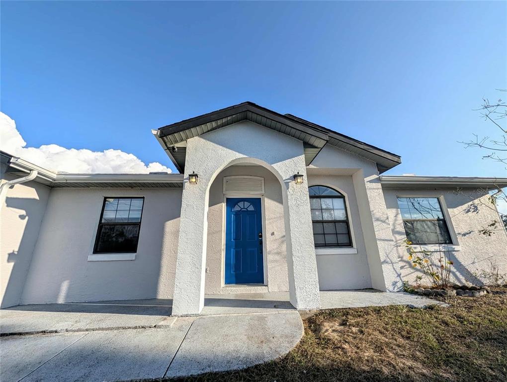 1511 Southwest Shorewood Drive Dunnellon, FL 34431 - Photo 29 of 31 a front view of a house with a garage