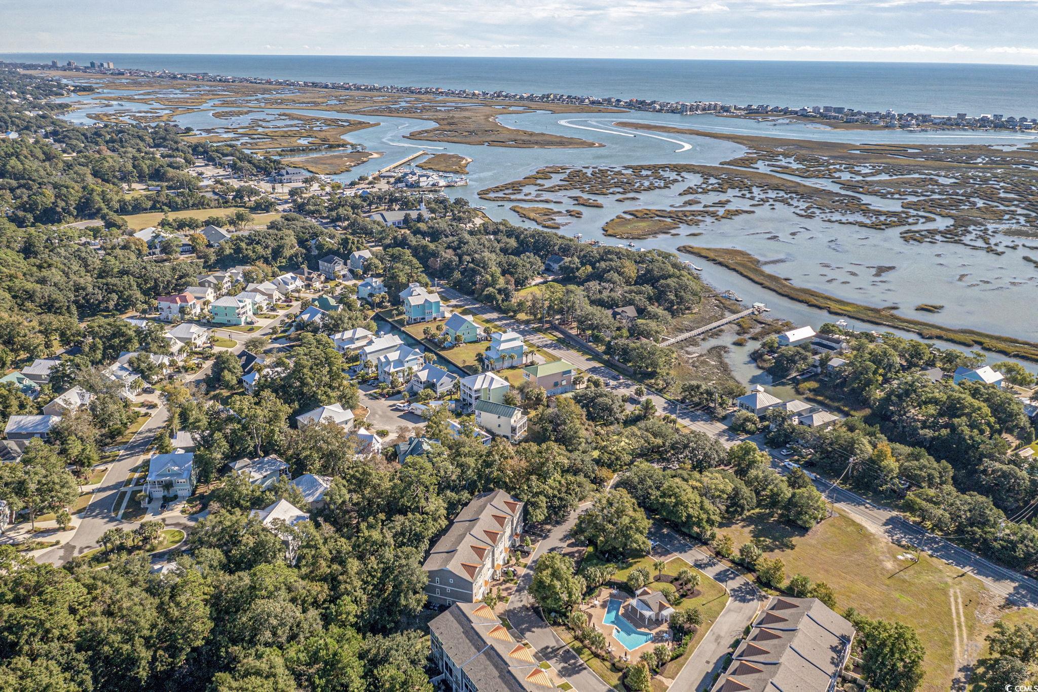 34 Shady Moss Loop, Unit 34 Murrells Inlet, SC 29576 - Photo 36 of 40 Aerial view of property and surrounding area featuring nearby suburban area and a nearby body of water