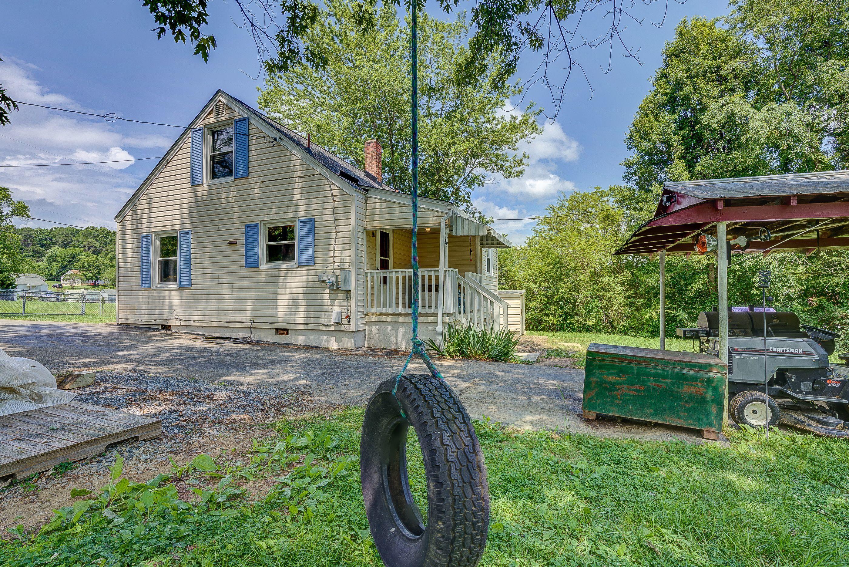 4417 Goodman Road Roanoke, VA 24014 - Photo 3 of 13 a front view of a house with a yard