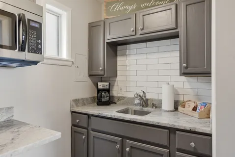 a kitchen with a sink and cabinets