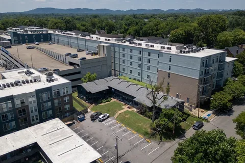 an aerial view of a house with a garden