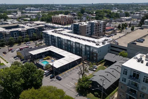 an aerial view of a city with lots of residential buildings