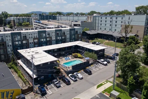 a view of a balcony with two chairs