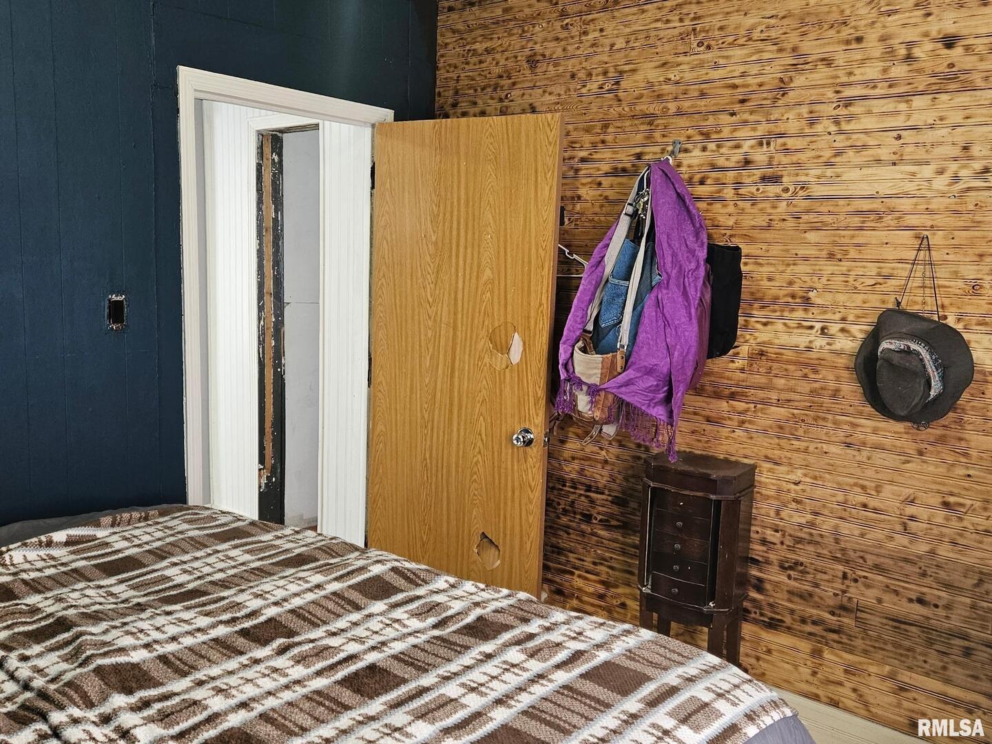 201 East May Street Joy, IL 61260 - Photo 14 of 18 a bedroom with a bed and a wooden floor