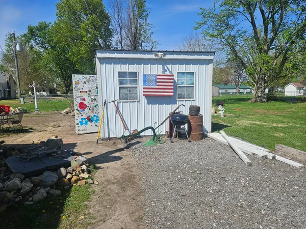 a view of a house with a back yard