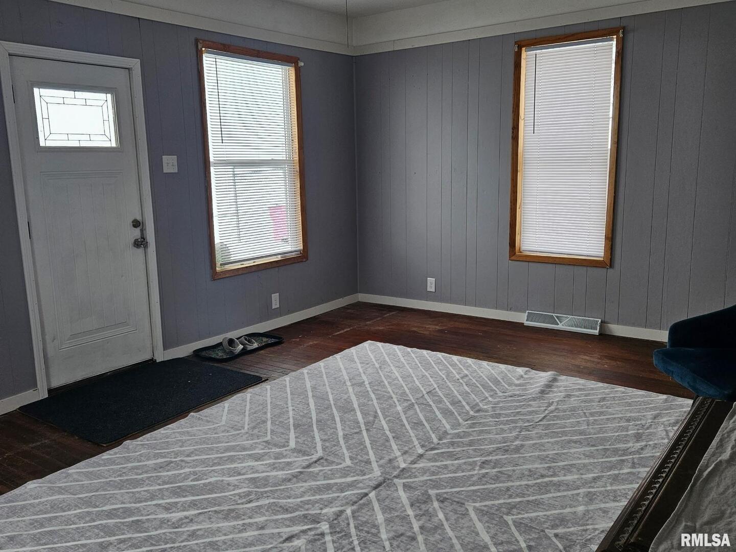 201 East May Street Joy, IL 61260 - Photo 9 of 18 a view of a livingroom with wooden floor and window