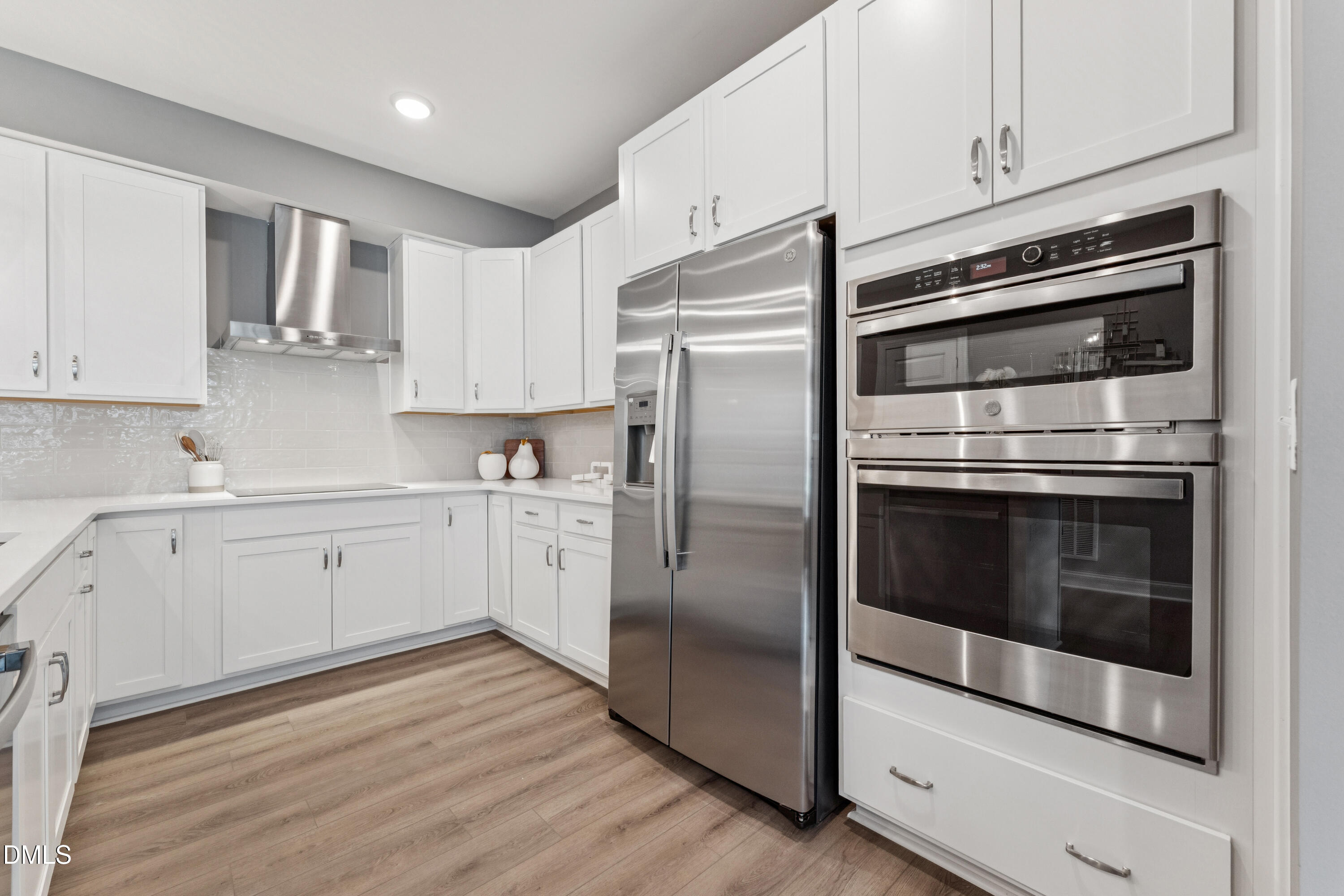 620 Hedrick Rdg Road, Unit 102 Cary, NC 27519 - Photo 3 of 30 a kitchen with cabinets and stainless steel appliances