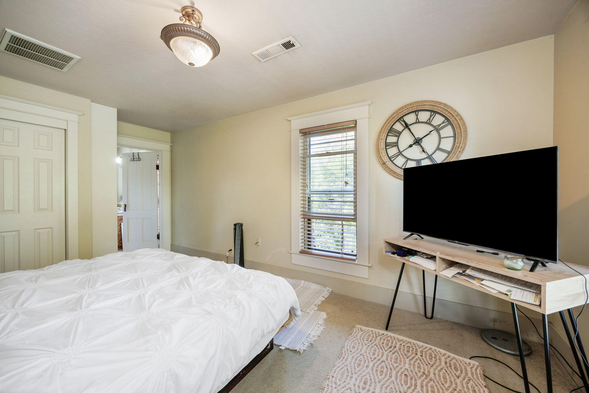 75 Wimer Street Ashland, OR 97520 - Photo 21 of 44 a bedroom with a bed and a flat screen tv