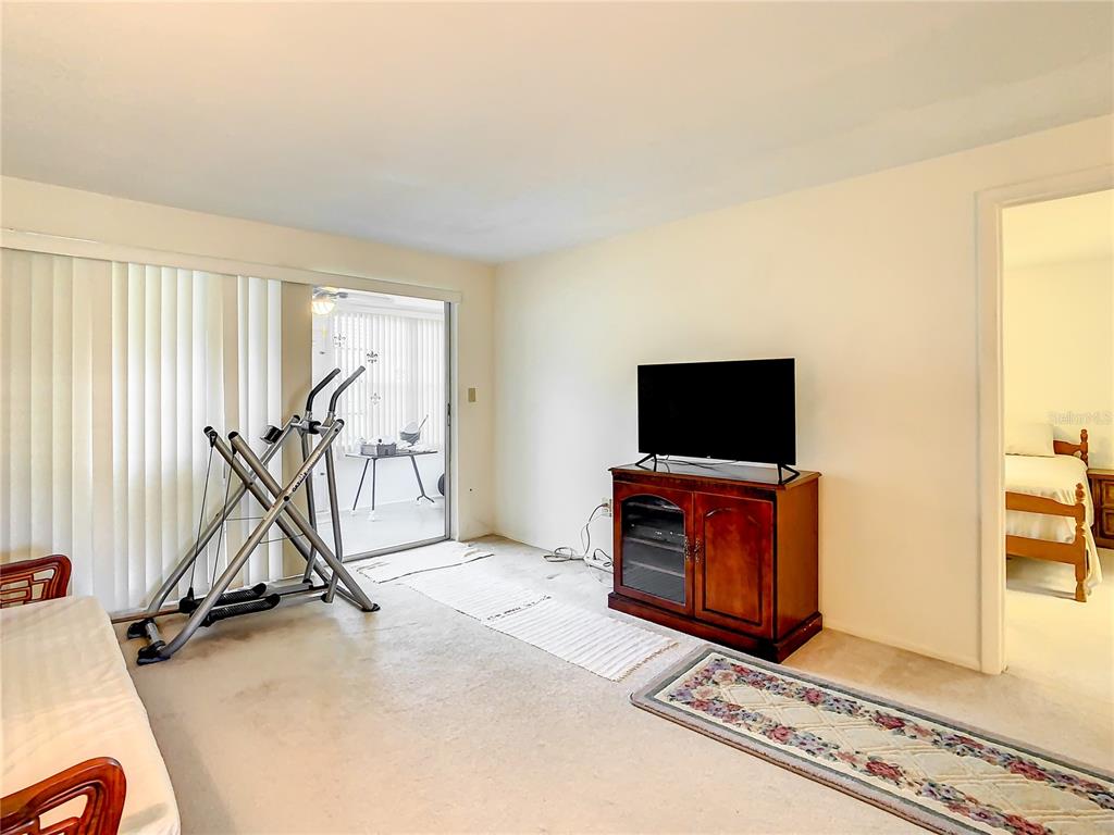 4230 Redcliff Place, Unit 4230 New Port Richey, FL 34652 - Photo 11 of 42 a view of an empty room with furniture and a window