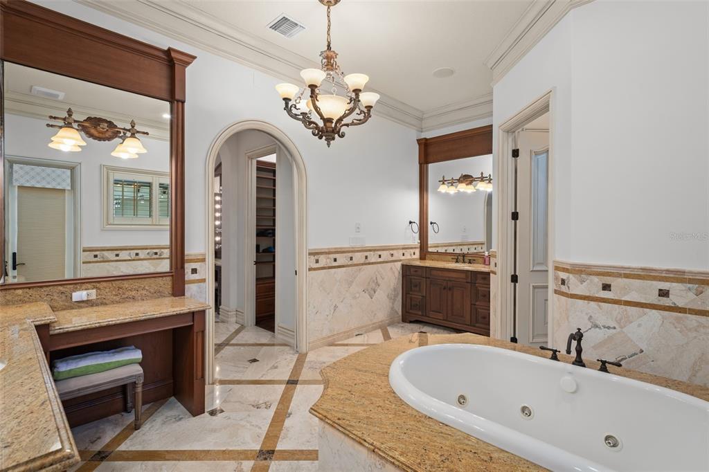4812 Alexandra Garden Court Windermere, FL 34786 - Photo 24 of 65 a spacious bathroom with a tub sink and a mirror