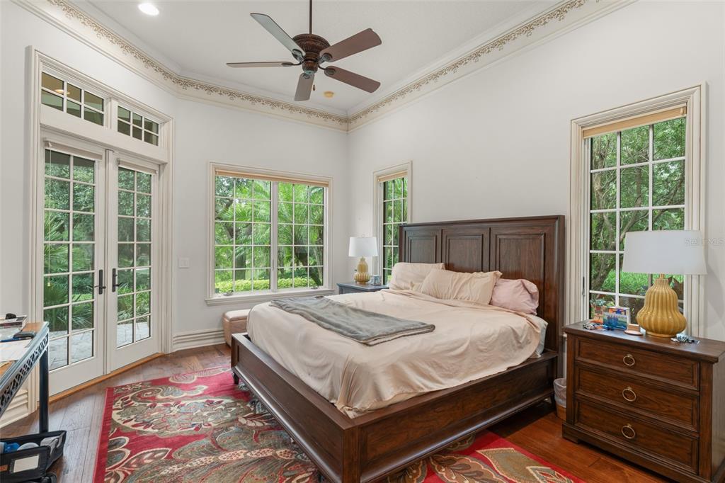 4812 Alexandra Garden Court Windermere, FL 34786 - Photo 29 of 65 a bed sitting in a bedroom next to a window