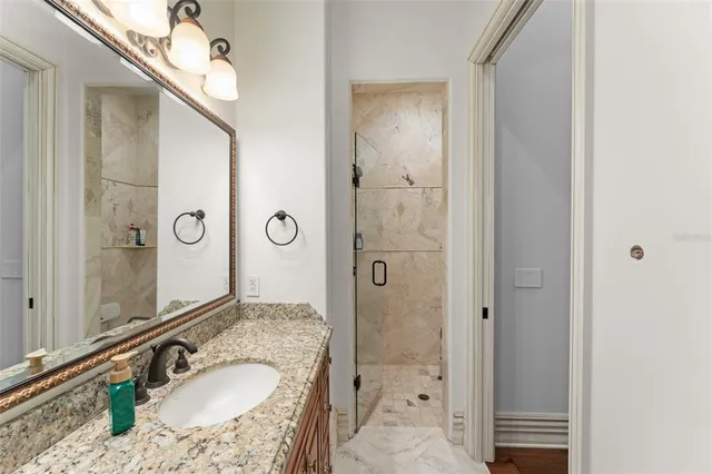 a view of a house with backyard sitting area and garden