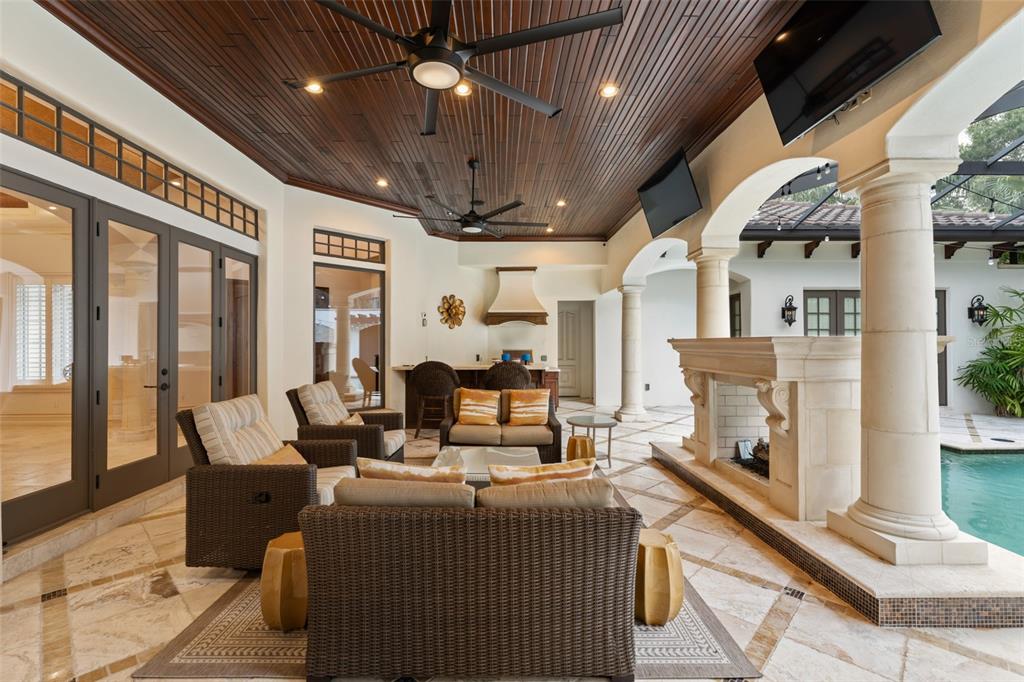 4812 Alexandra Garden Court Windermere, FL 34786 - Photo 34 of 65 a living room with furniture and a fireplace