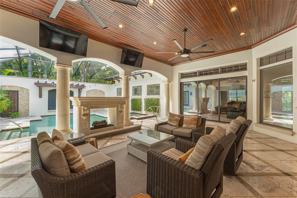 4812 Alexandra Garden Court Windermere, FL 34786 - Photo 36 of 65 a living room with furniture a flat screen tv and a large window