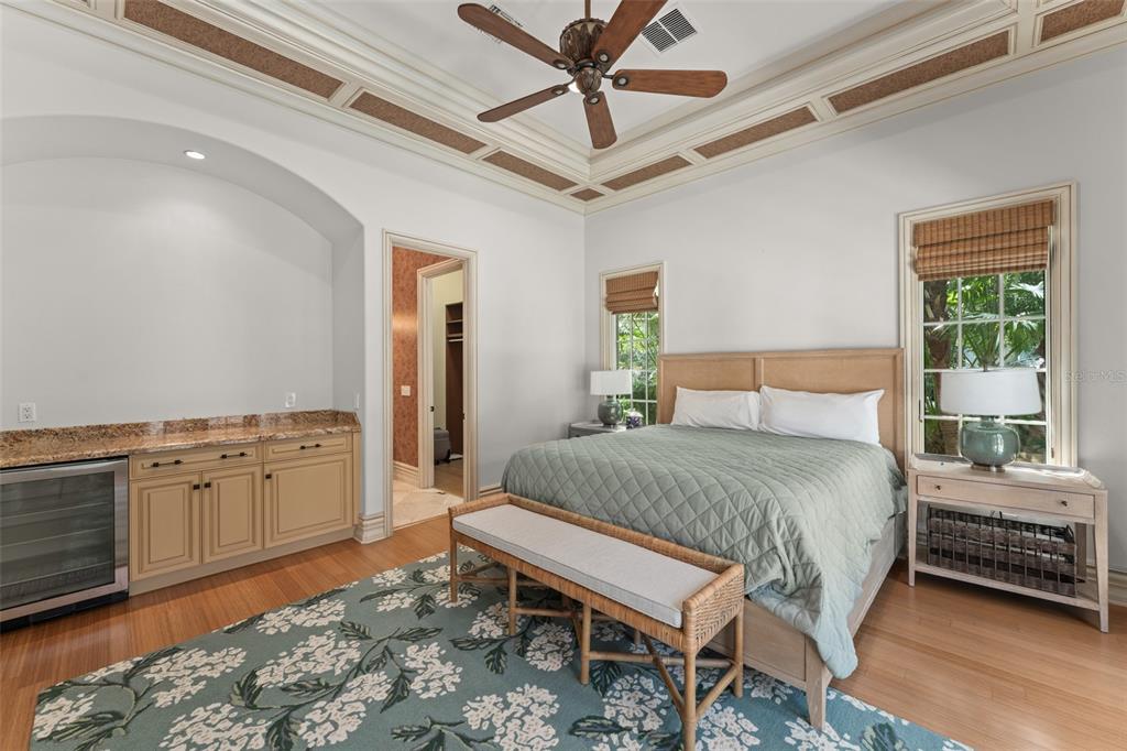 4812 Alexandra Garden Court Windermere, FL 34786 - Photo 44 of 65 a bedroom with a bed dresser and a window