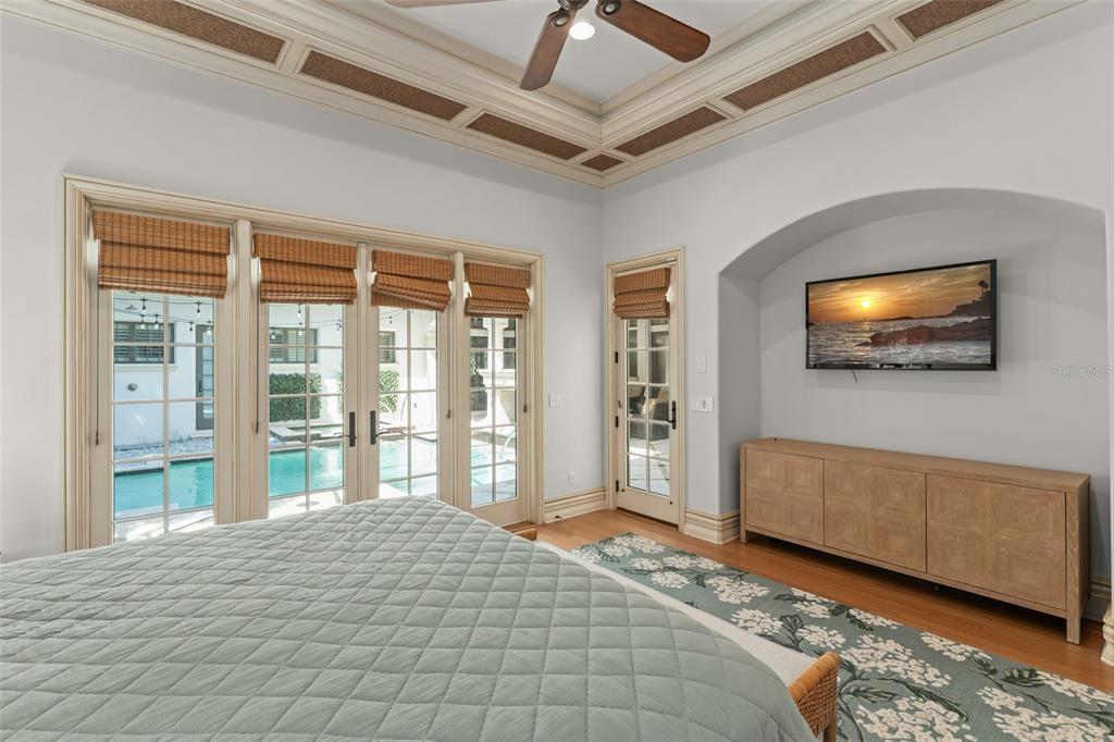 4812 Alexandra Garden Court Windermere, FL 34786 - Photo 45 of 65 a spacious bedroom with a large bed and a flat tv screen
