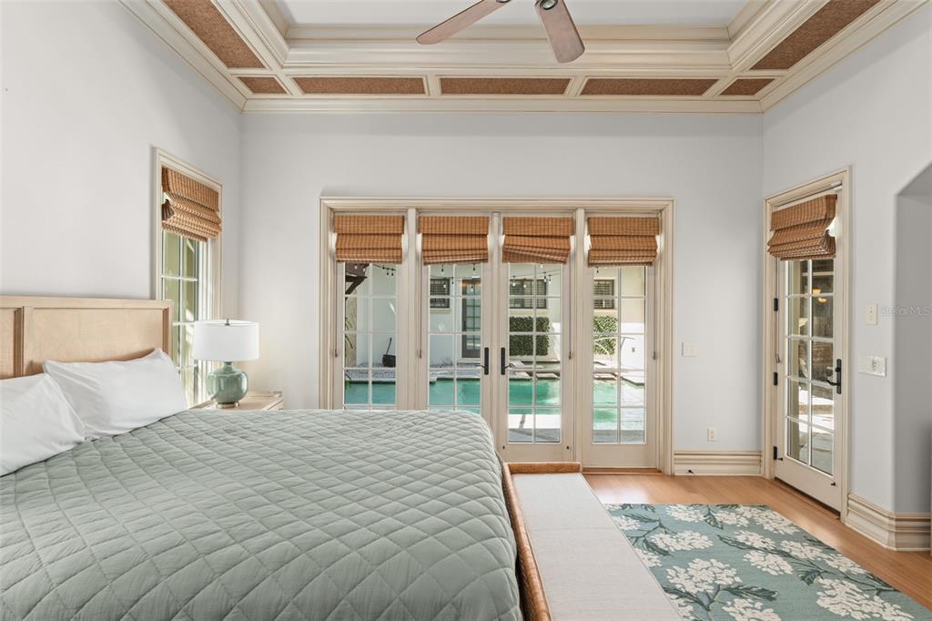 4812 Alexandra Garden Court Windermere, FL 34786 - Photo 46 of 65 a bedroom with a large bed and a large window