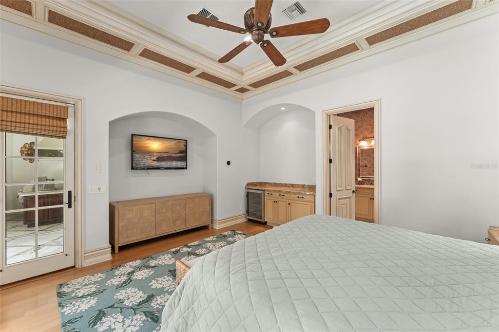 4812 Alexandra Garden Court Windermere, FL 34786 - Photo 47 of 65 a bedroom with a bed and a flat screen tv