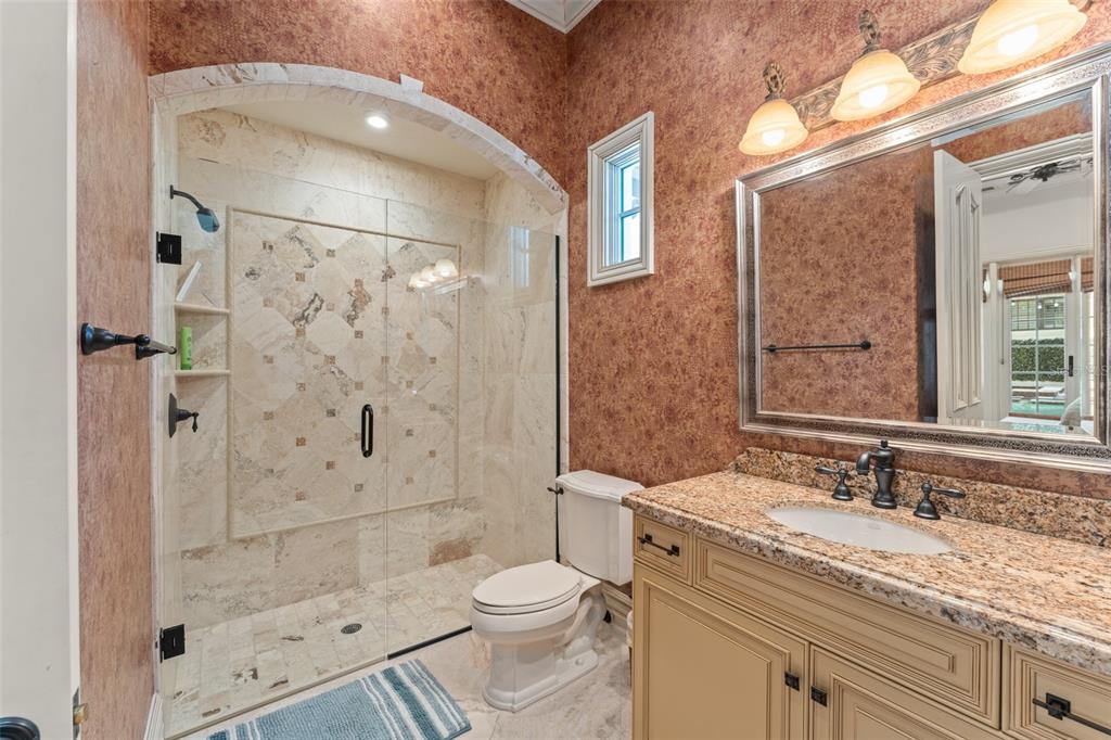 4812 Alexandra Garden Court Windermere, FL 34786 - Photo 48 of 65 a bathroom with a granite countertop sink toilet and shower