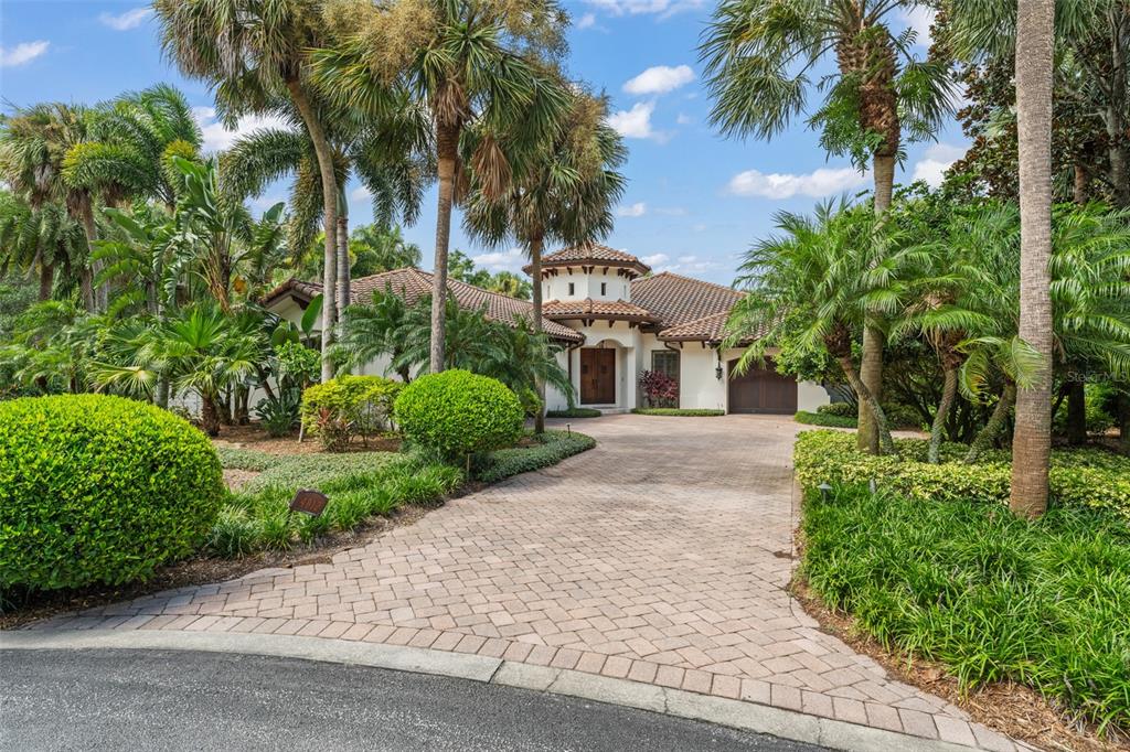 4812 Alexandra Garden Court Windermere, FL 34786 - Photo 62 of 65 a front view of a house with a garden
