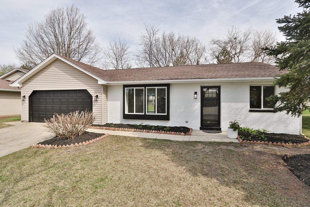 464 Winterwood Drive Roselle, IL 60172 - Photo 1 of 39 a front view of a house with a yard and garage