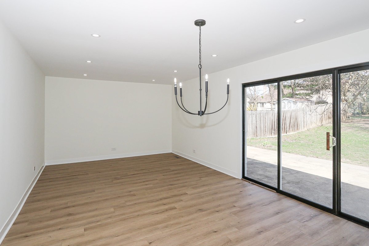 464 Winterwood Drive Roselle, IL 60172 - Photo 11 of 39 a view of an empty room with glass door