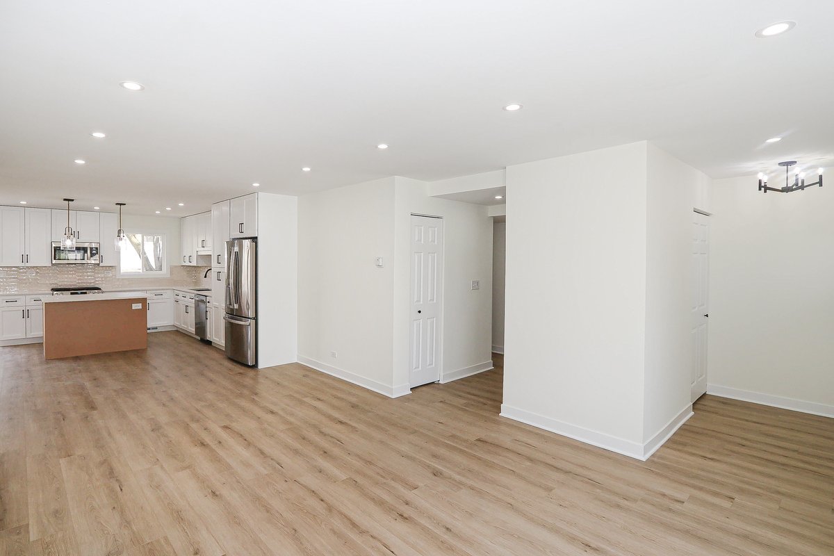 464 Winterwood Drive Roselle, IL 60172 - Photo 16 of 39 a view of a kitchen with a sink and a refrigerator