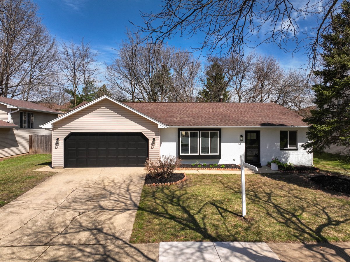 464 Winterwood Drive Roselle, IL 60172 - Photo 2 of 39 a front view of house with yard and trees in the background