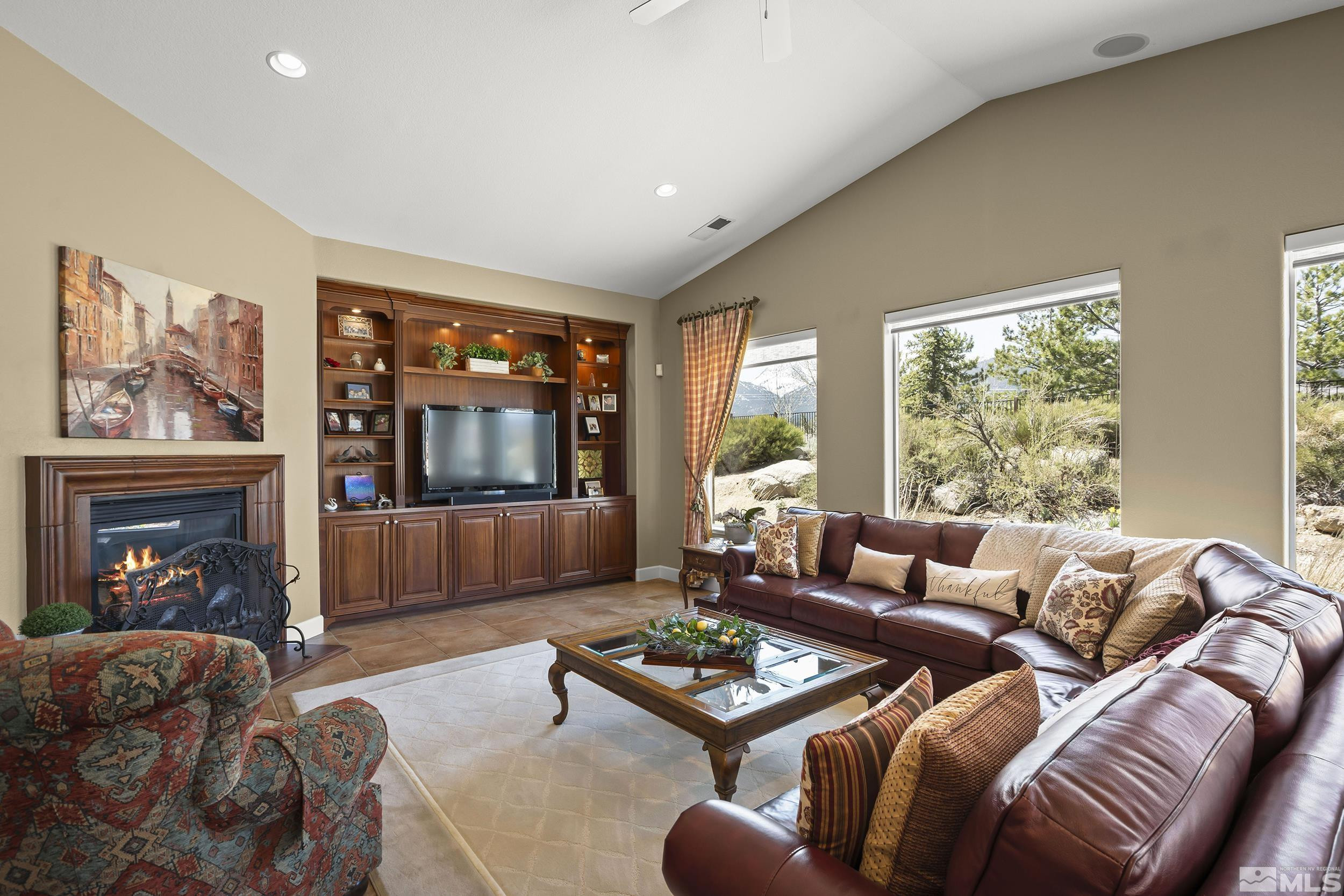 15300 Redmond Loop Reno, NV 89511 - Photo 12 of 35 a living room with furniture and a fireplace