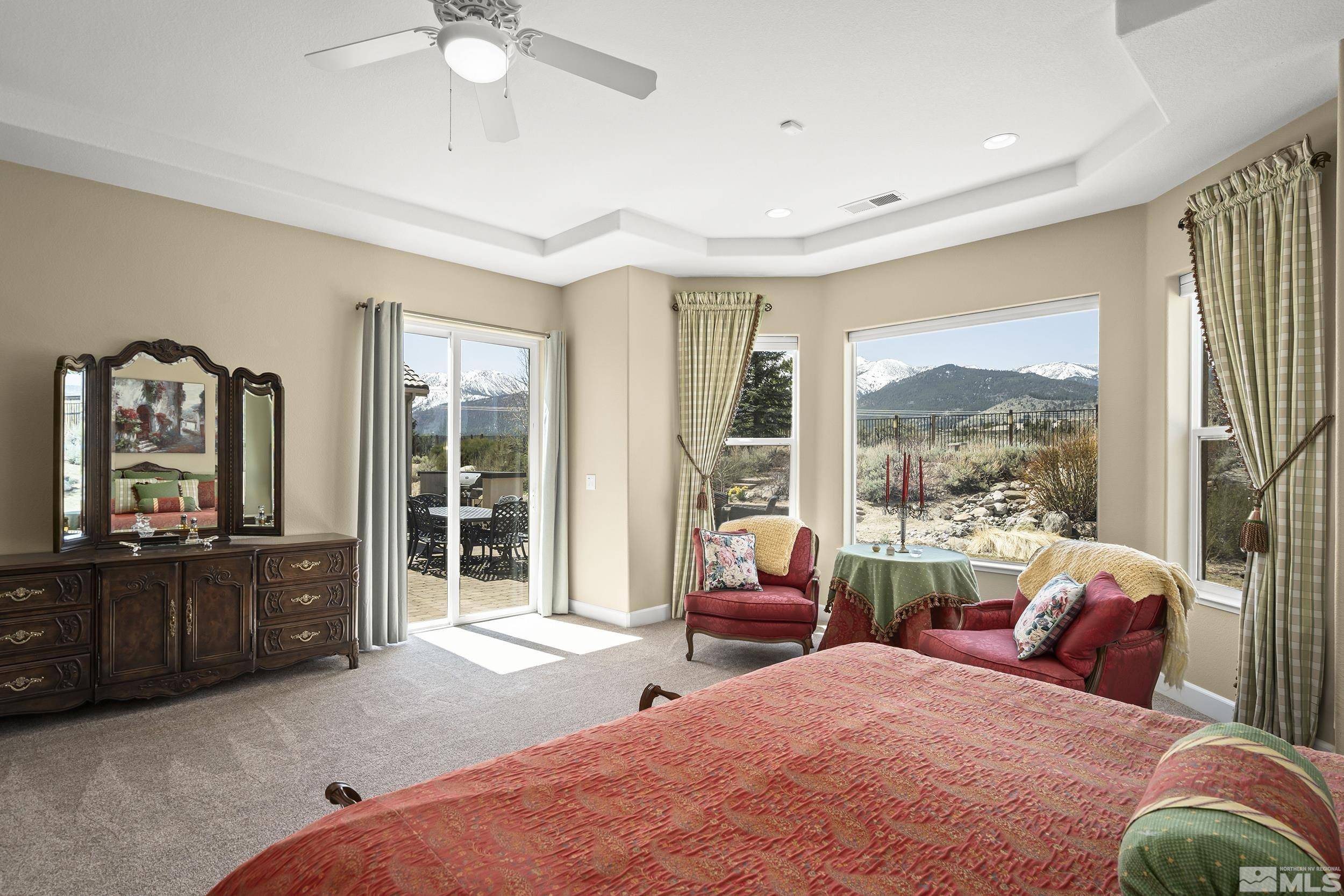 15300 Redmond Loop Reno, NV 89511 - Photo 17 of 35 a bedroom with a bed a large window couch and dresser