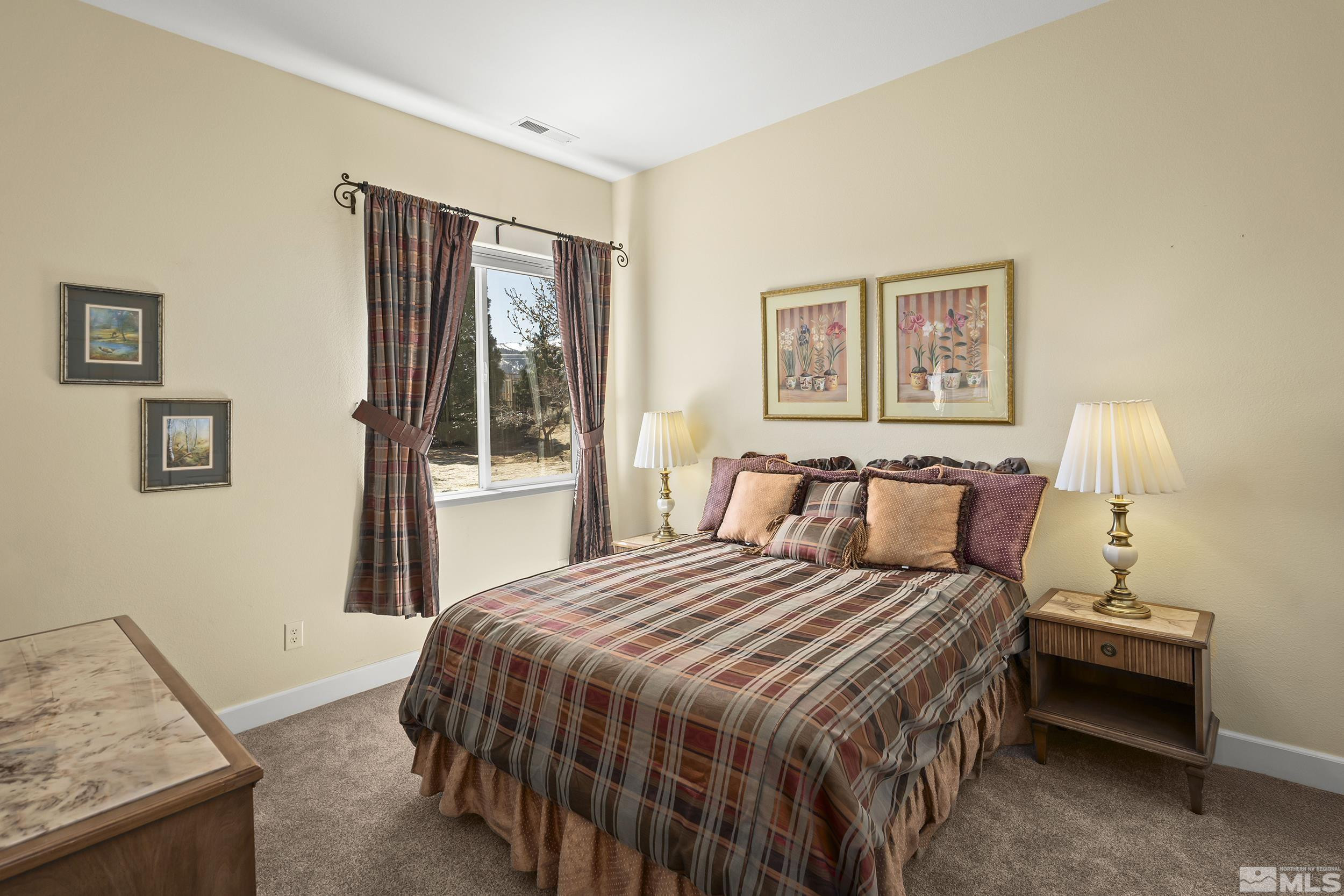 15300 Redmond Loop Reno, NV 89511 - Photo 22 of 35 a bedroom with a bed and a window