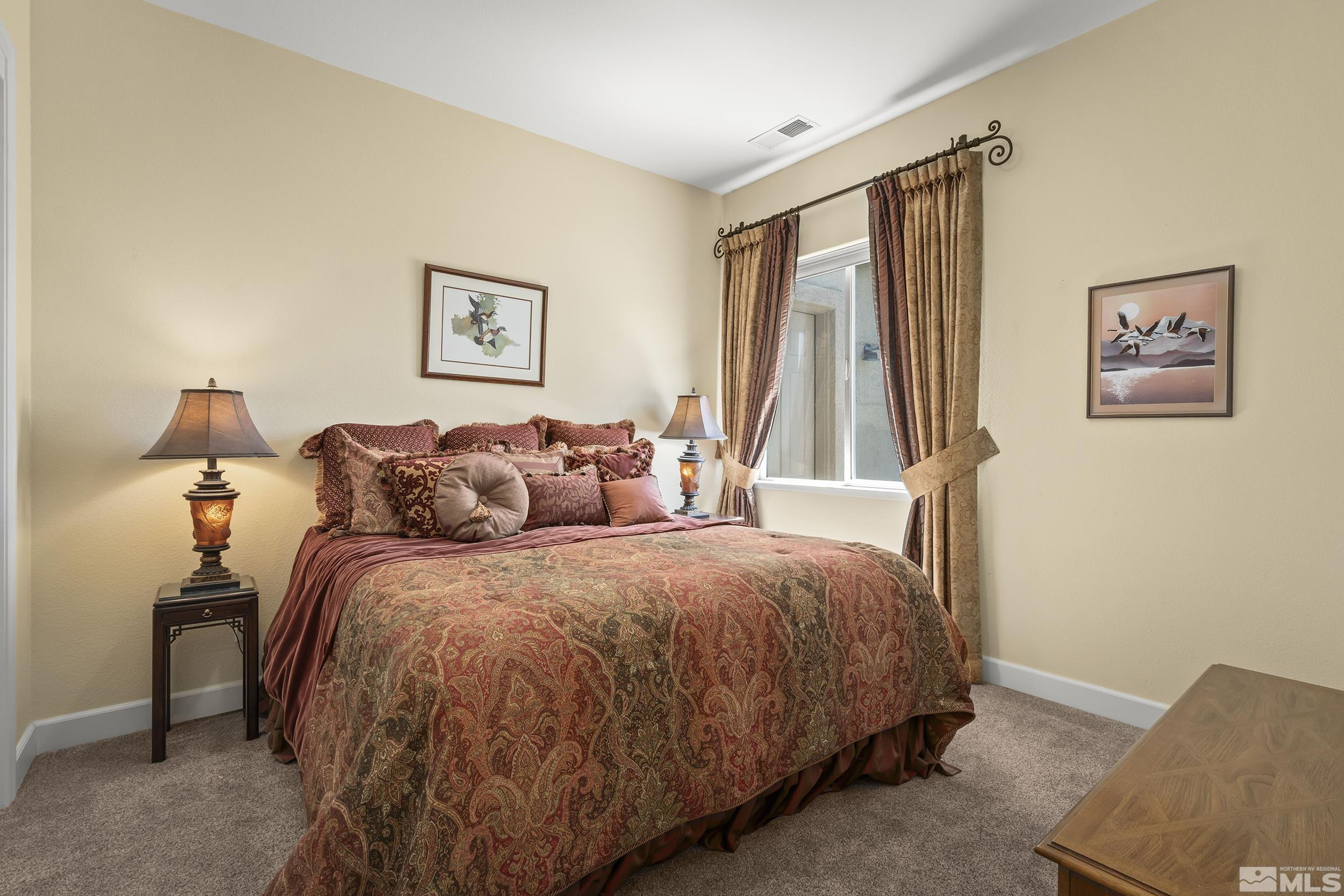 15300 Redmond Loop Reno, NV 89511 - Photo 25 of 35 a bed room with a bed and a couch