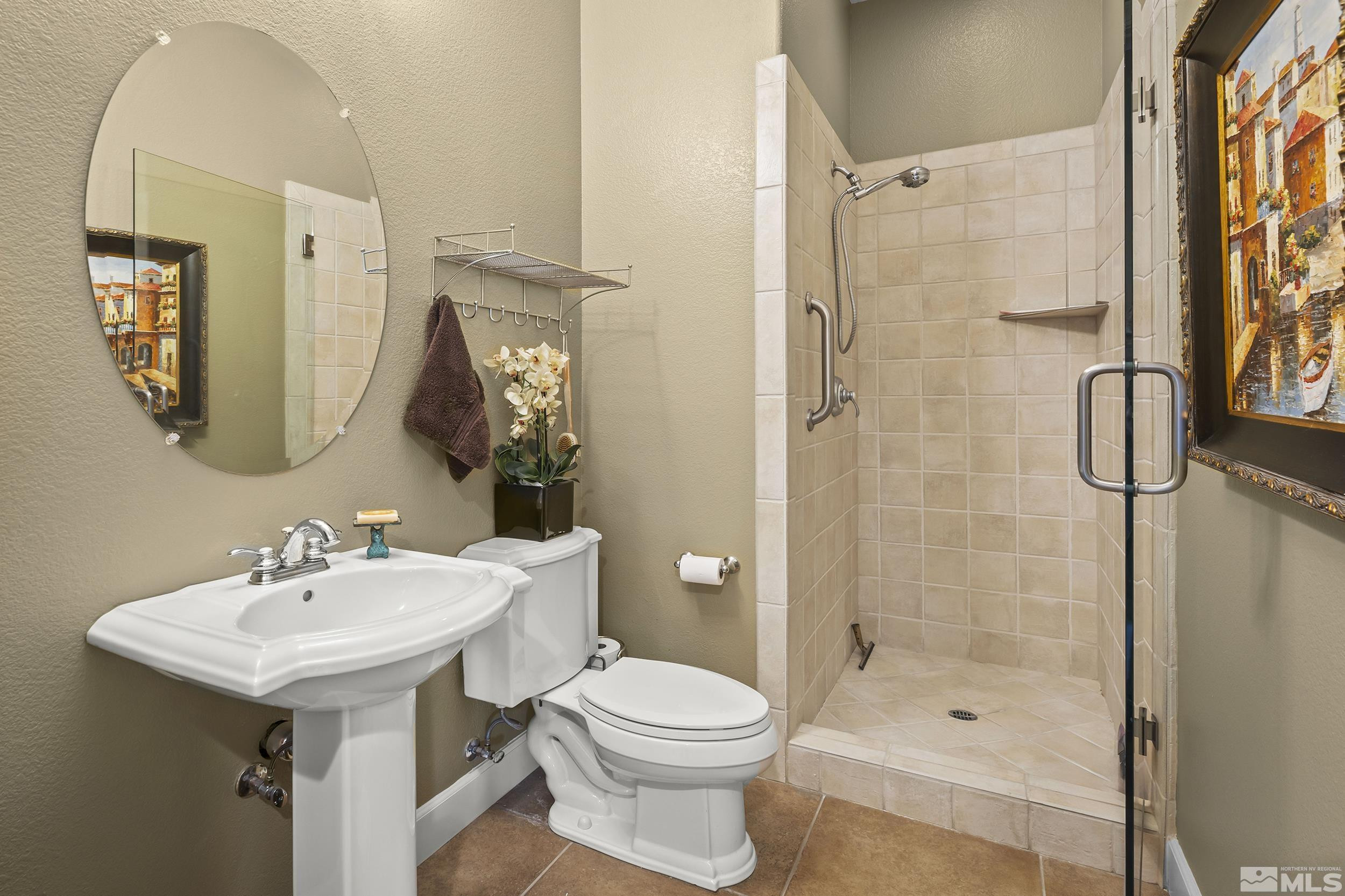 15300 Redmond Loop Reno, NV 89511 - Photo 29 of 35 a bathroom with a sink toilet and shower