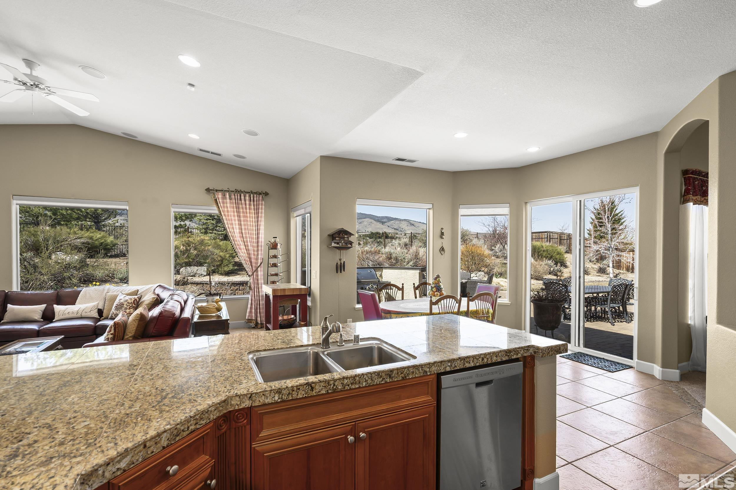 15300 Redmond Loop Reno, NV 89511 - Photo 7 of 35 a kitchen with sink refrigerator and large window