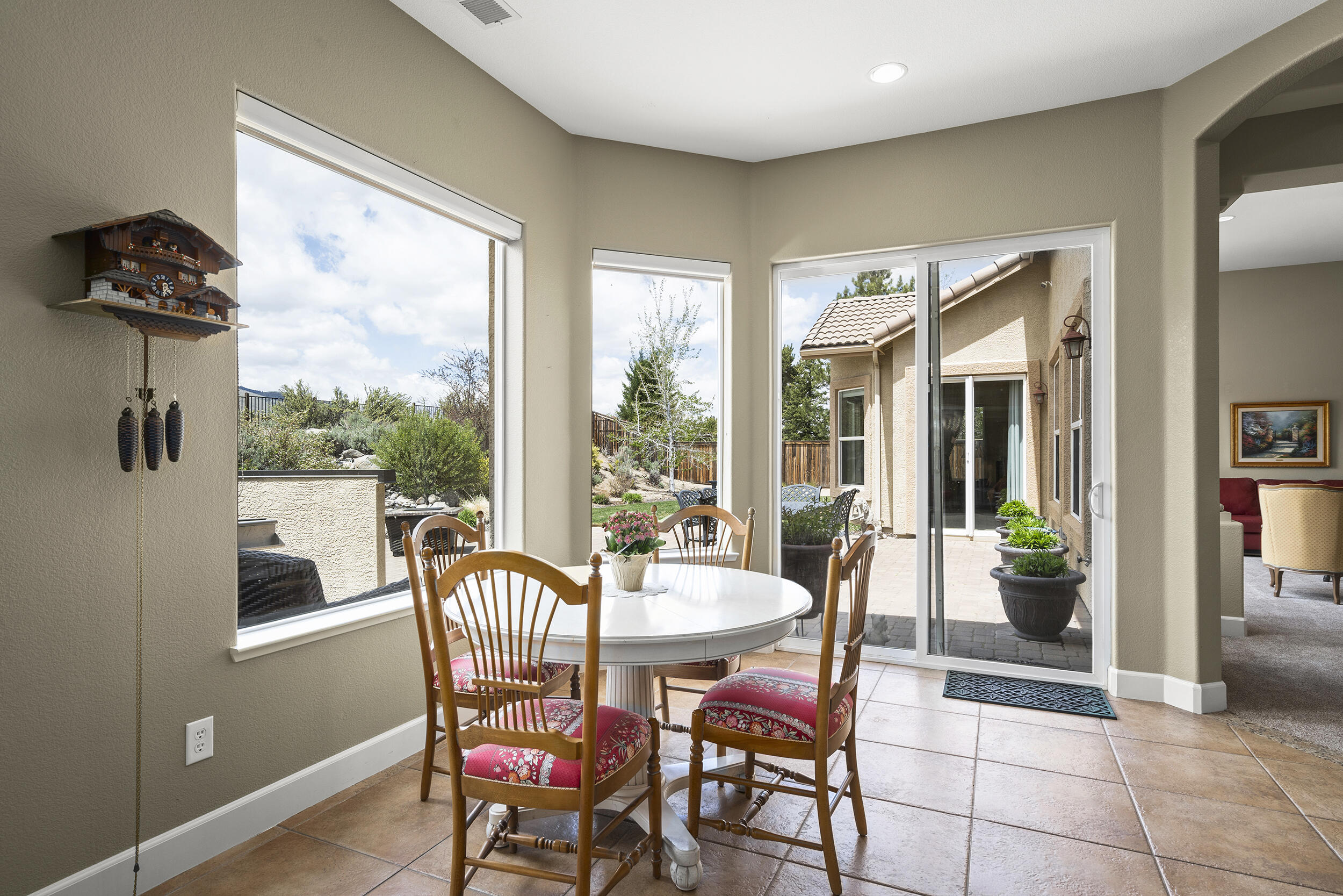 15300 Redmond Loop Reno, NV 89511 - Photo 9 of 35 a dining room with furniture a chandelier and wooden floor