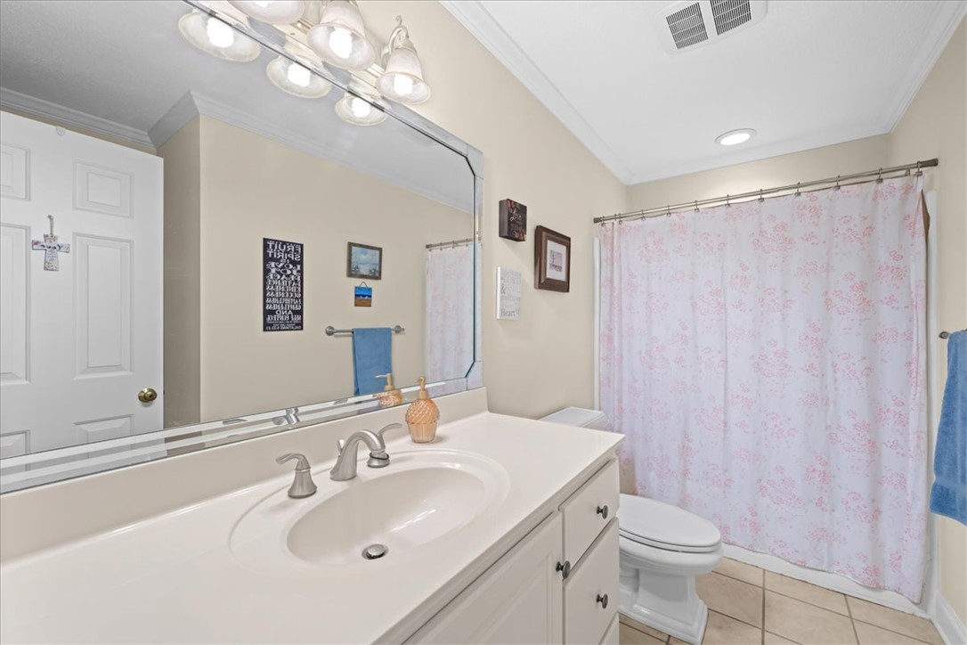 2004 Cardinal Park Drive Anderson, SC 29621 - Photo 29 of 40 Crisp crown molding and neutral tile flooring define this classic bathroom space.