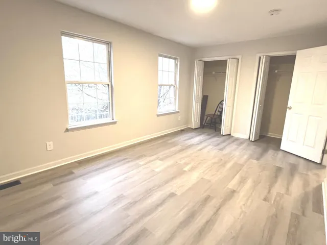 a view of an empty room and a window