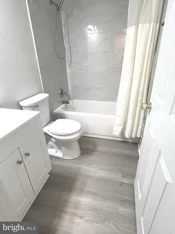 a bathroom with a toilet a sink and a bathtub