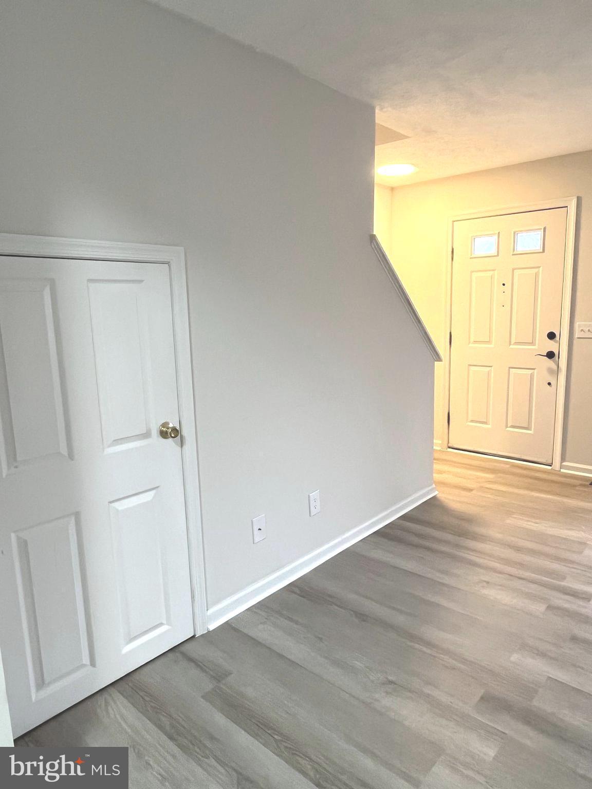 305 Sutton Court Winchester, VA 22601 - Photo 9 of 40 a view of an empty room with wooden floor