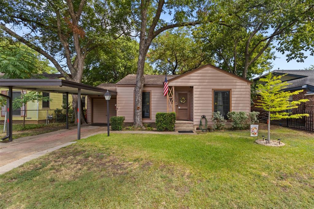1703 Brandon Street Dallas, TX 75208 - Photo 2 of 16 a front view of a house with a yard