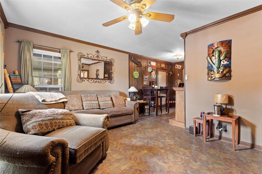1703 Brandon Street Dallas, TX 75208 - Photo 4 of 16 a living room with furniture and a large window