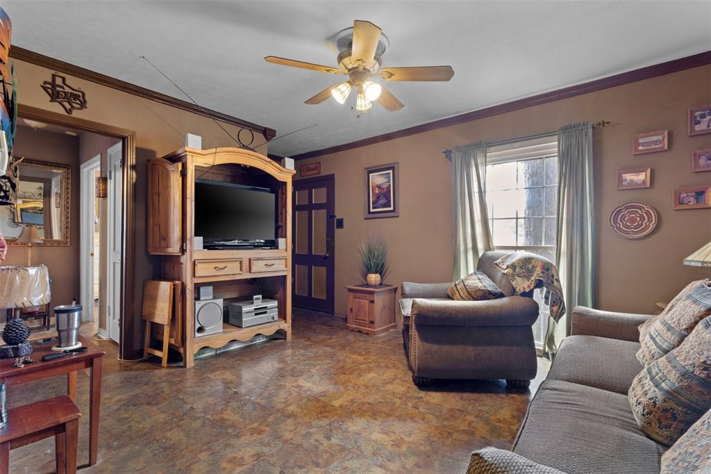 1703 Brandon Street Dallas, TX 75208 - Photo 5 of 16 a living room with furniture and a flat screen tv