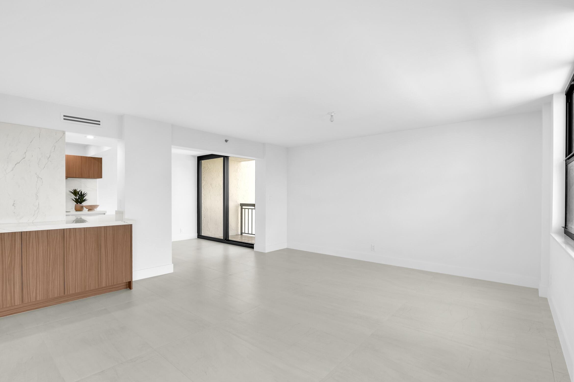 2001 North Ocean Boulevard, Unit 502 Boca Raton, FL 33431 - Photo 15 of 67 a view of a big room with wooden floor and windows