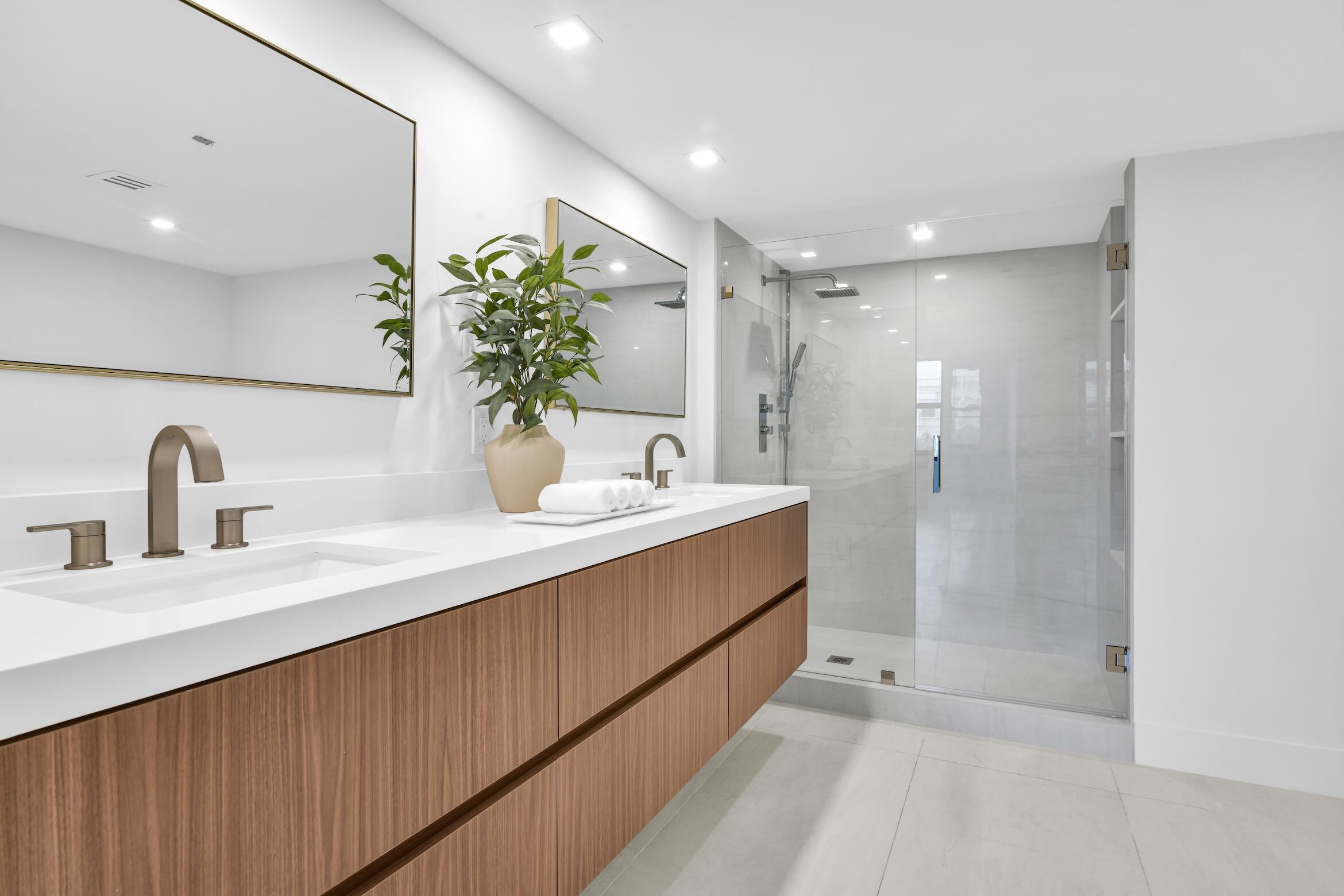 2001 North Ocean Boulevard, Unit 502 Boca Raton, FL 33431 - Photo 28 of 67 a bathroom with a double vanity sink and a mirror
