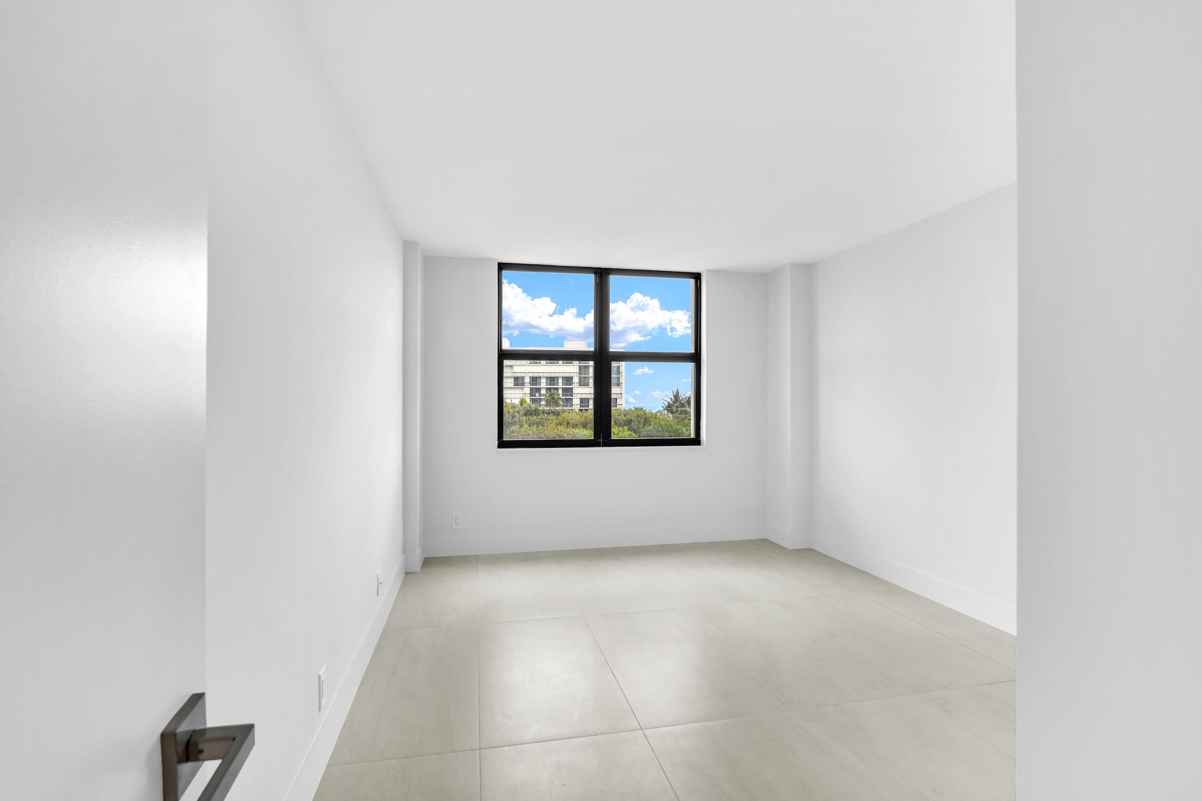 2001 North Ocean Boulevard, Unit 502 Boca Raton, FL 33431 - Photo 35 of 67 an empty room with windows
