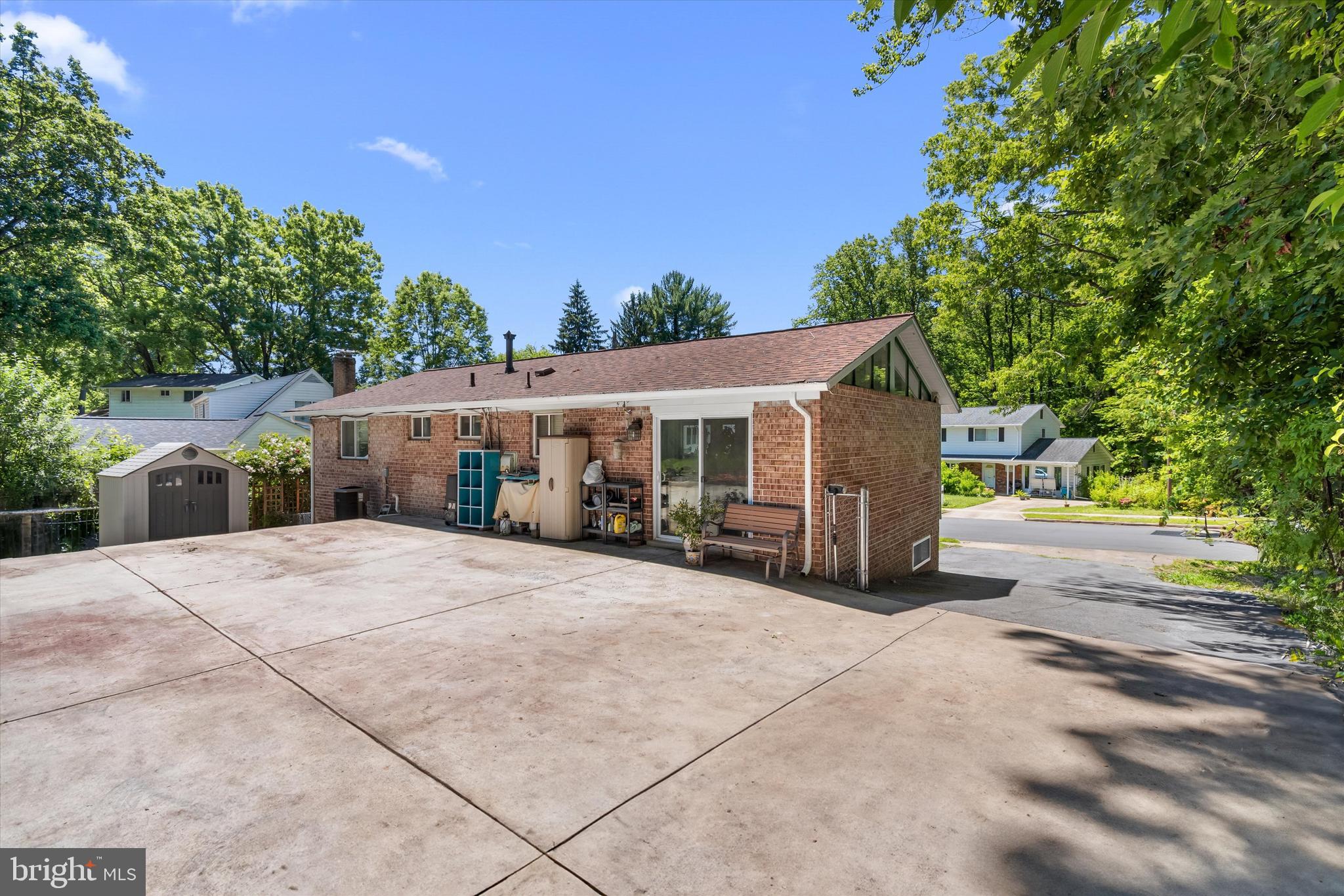 8304 Harland Drive Springfield, VA 22152 - Photo 34 of 39 a front view of a house with a garden